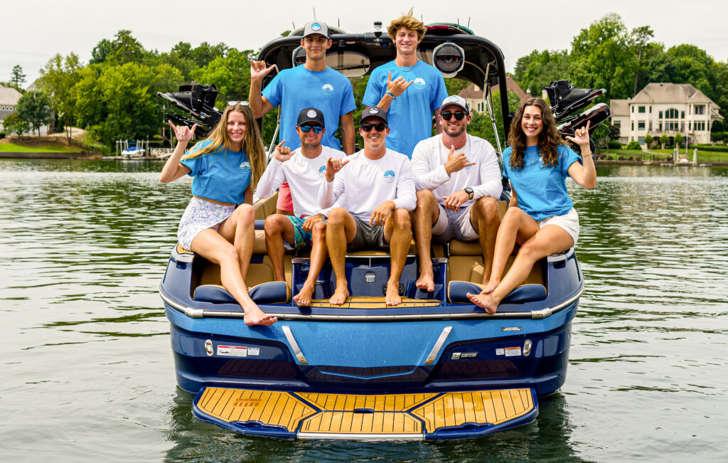 Boat crew sitting on back of boat for Lake Lanier Boat Charters